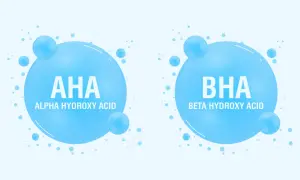 Dwa bąbelki z napisem AHA (Alpha Hydroxy Acid) i BHA (Beta Hydroxy Acid), symbolizujące składniki kosmetyków.
