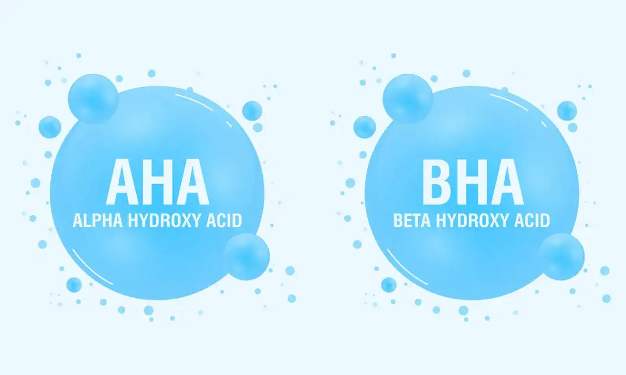 Dwa bąbelki z napisem AHA (Alpha Hydroxy Acid) i BHA (Beta Hydroxy Acid), symbolizujące składniki kosmetyków.